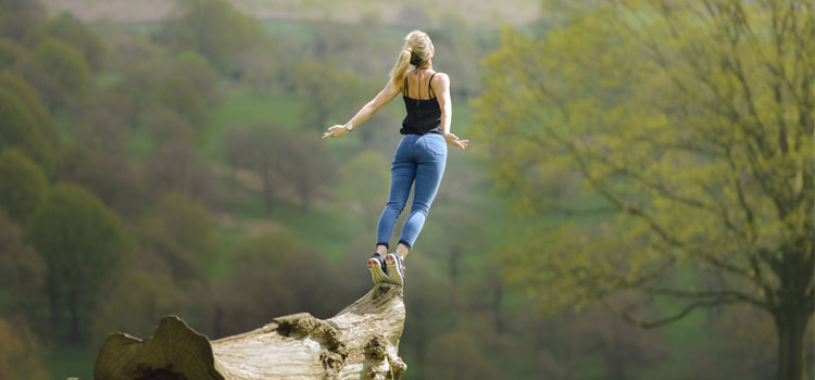 Woman-Gracefully-Falling-&-Jumping-Of-Tree-In-Field