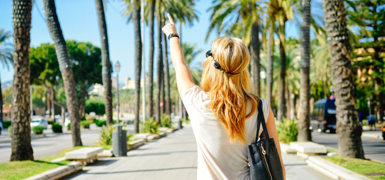 Girl-Pointing-At-Sky-In-Summer