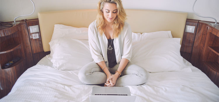 Girl-Using-Laptop-In-Hotel-Room